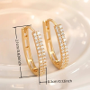Gold circular hoop earrings with double row of sparkling zirconia - size of earrings