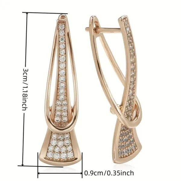 Gold crystal drop earrings with modern sculptural twist design - size of earrings