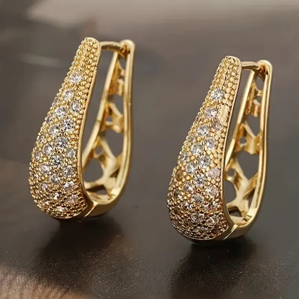 Miami-style gold hoop earrings with cubic zirconia and bold design