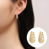 Miami-style gold hoop earrings with cubic zirconia and bold design - women using earrings