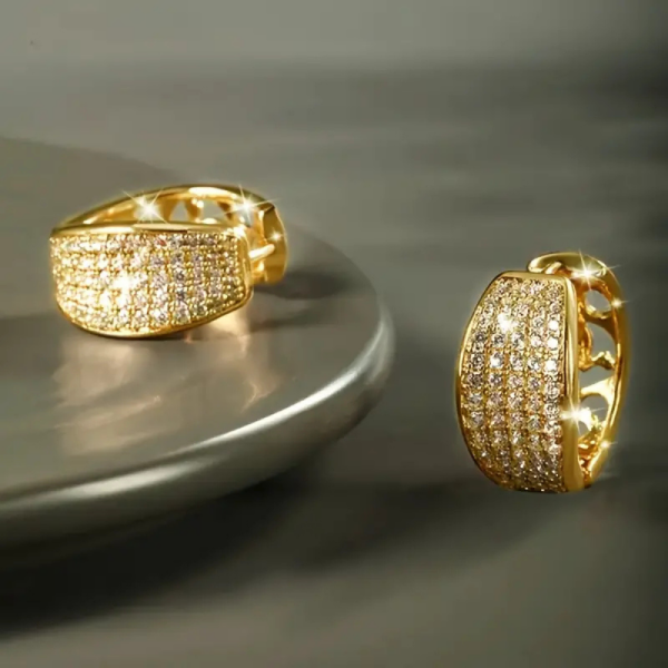 Earrings laying flat. Pair Women's Fashion Hoop Earrings with Dense Shiny Synthetic Zirconia, Small Circle Design, Copper Base, Elegant & Glittery Style for Daily Wear and Banquets, Luxurious Jewelry